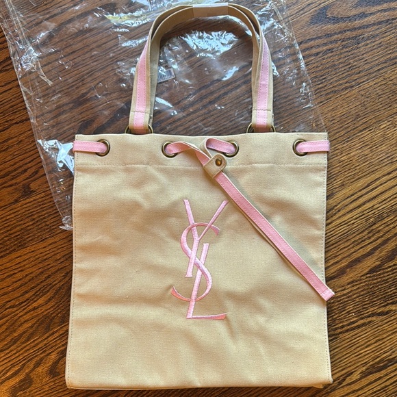 YSL tan canvas pink embroidered woven grosgrain/canvas drawstring closure tote. - Picture 1 of 6